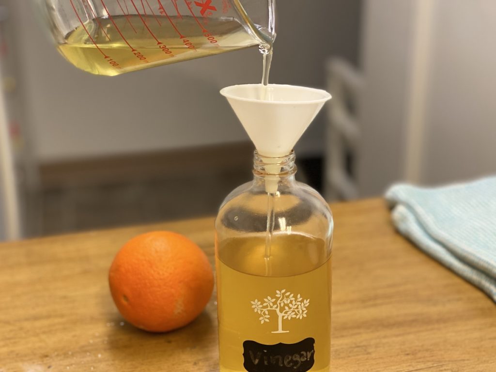 pour the orange vinegar cleaner